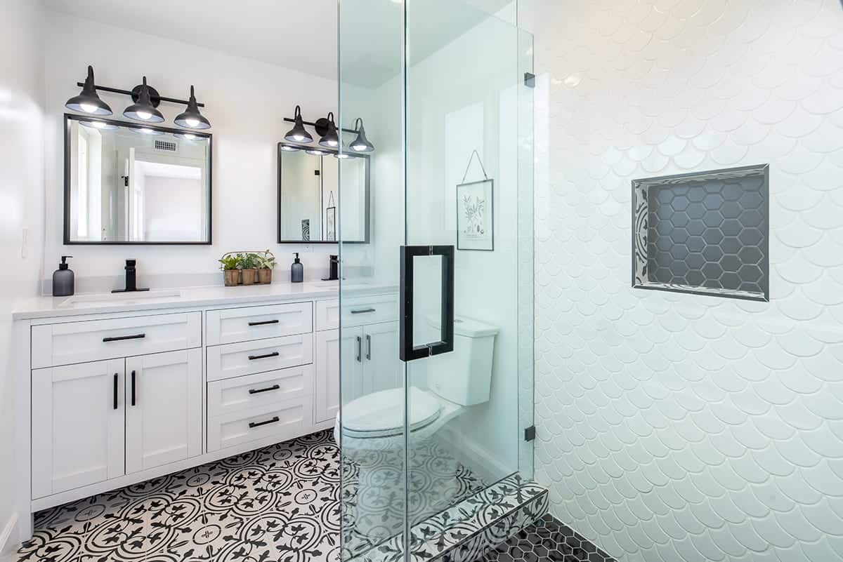 Bathroom with double vanity and glass shower